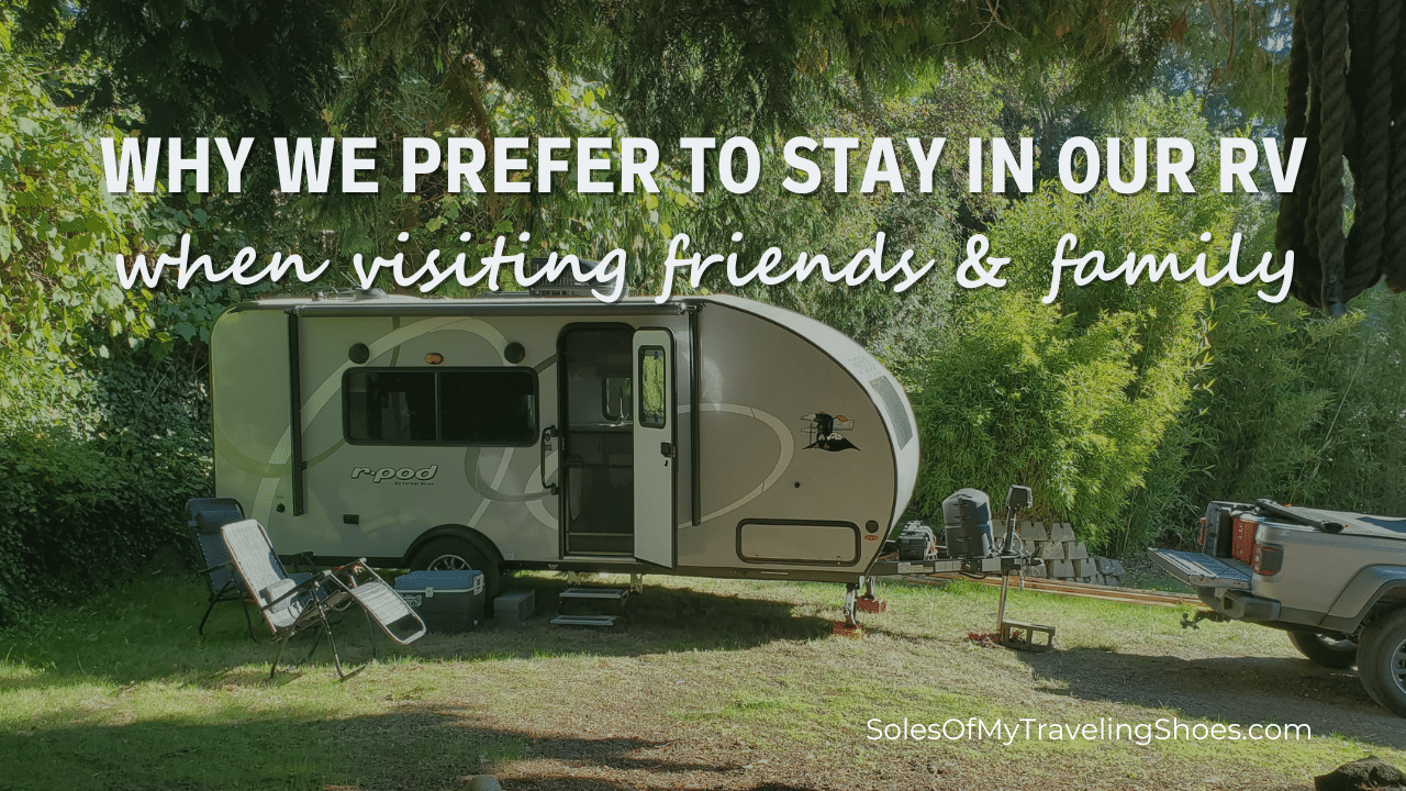 rpod rv in driveway surrounded by greenery